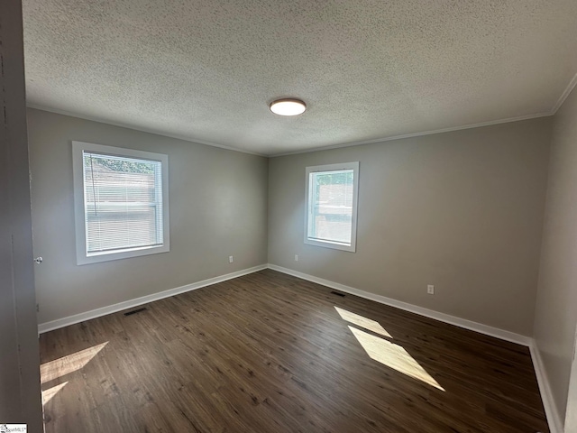 121 Pacolet Hwy, Gaffney, SC 29340 - spare room featuring baseboards, dark wood-type flooring, crown molding, and a textured ceiling