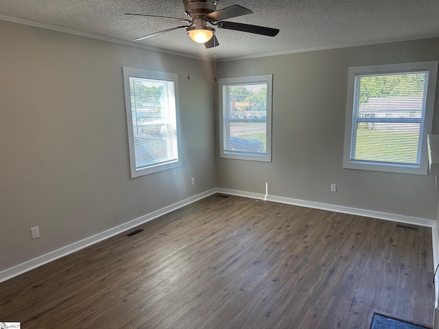 121 Pacolet Hwy, Gaffney, SC 29340 - empty room featuring a textured ceiling, ornamental molding, plenty of natural light, dark wood finished floors, and ceiling fan