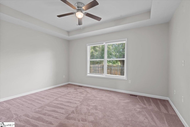 514 Habersham Ln, Easley, SC 29642 - carpeted spare room featuring ceiling fan, baseboards, and a tray ceiling