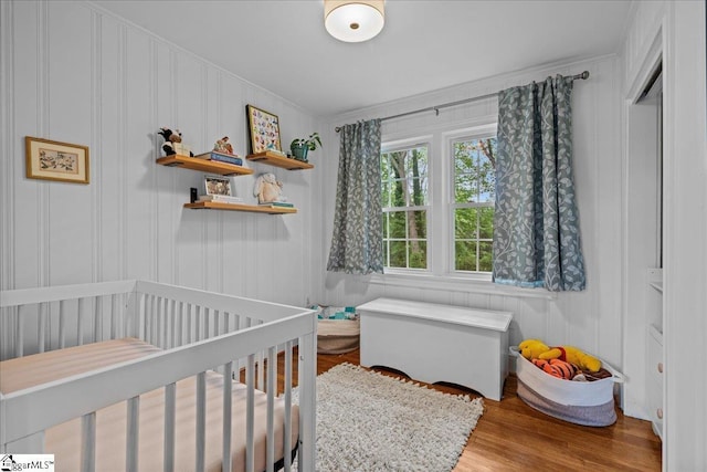 116 Twinbrook Dr, Greenville, SC 29607 - bedroom with wood finished floors, a crib, and crown molding