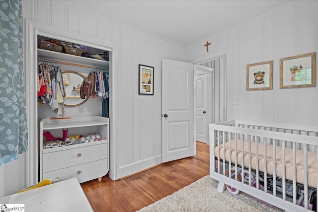 116 Twinbrook Dr, Greenville, SC 29607 - bedroom featuring ornamental molding, wood finished floors, a nursery area, and a closet