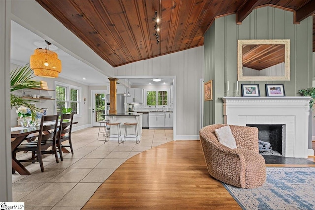 116 Twinbrook Dr, Greenville, SC 29607 - living area with vaulted ceiling, light tile patterned floors, baseboards, a fireplace, and wooden ceiling