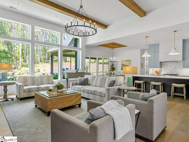 294 Lyman Lake Rd, Lyman, SC 29365 - living area featuring a chandelier, light wood-style flooring, and beam ceiling