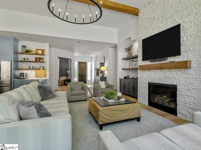 294 Lyman Lake Rd, Lyman, SC 29365 - living area featuring light wood finished floors, a fireplace, beamed ceiling, a chandelier, and recessed lighting