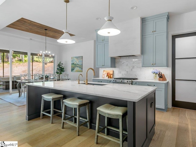 294 Lyman Lake Rd, Lyman, SC 29365 - kitchen featuring light wood-style floors, light stone countertops, backsplash, a sink, and recessed lighting