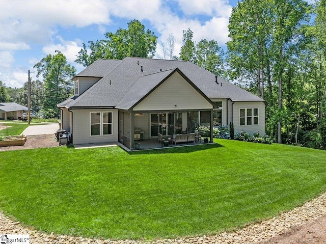 294 Lyman Lake Rd, Lyman, SC 29365 - back of house with a sunroom, a yard, and roof with shingles