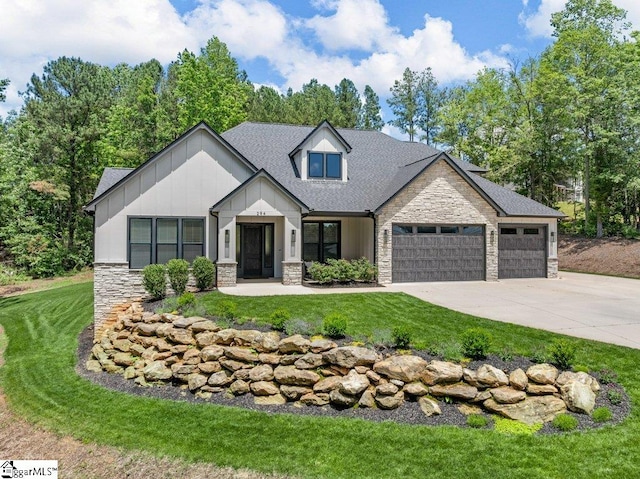 294 Lyman Lake Rd, Lyman, SC 29365 - view of front of house with stone siding, board and batten siding, a garage, and a front lawn