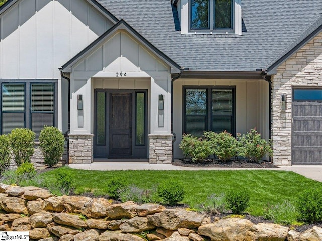 294 Lyman Lake Rd, Lyman, SC 29365 - property entrance featuring stone siding, board and batten siding, a shingled roof, and a garage