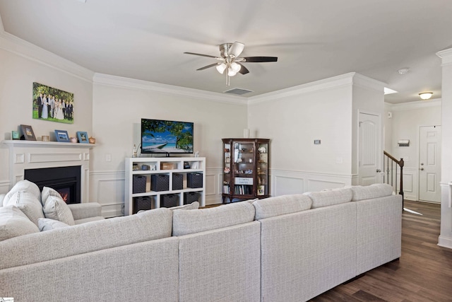 412 Kindletree Way, Simpsonville, SC 29680 - living room with ornamental molding, ceiling fan, a decorative wall, a glass covered fireplace, and dark wood-type flooring