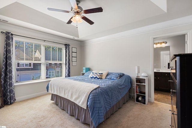 412 Kindletree Way, Simpsonville, SC 29680 - bedroom with light carpet, a tray ceiling, baseboards, crown molding, and connected bathroom