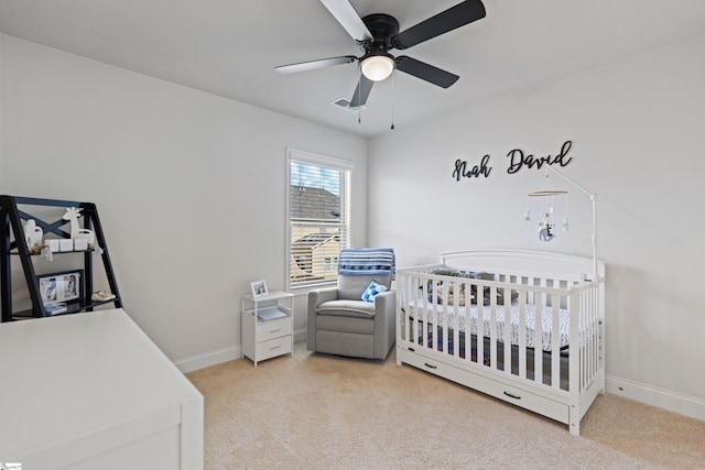 412 Kindletree Way, Simpsonville, SC 29680 - bedroom featuring light colored carpet, a crib, baseboards, and ceiling fan