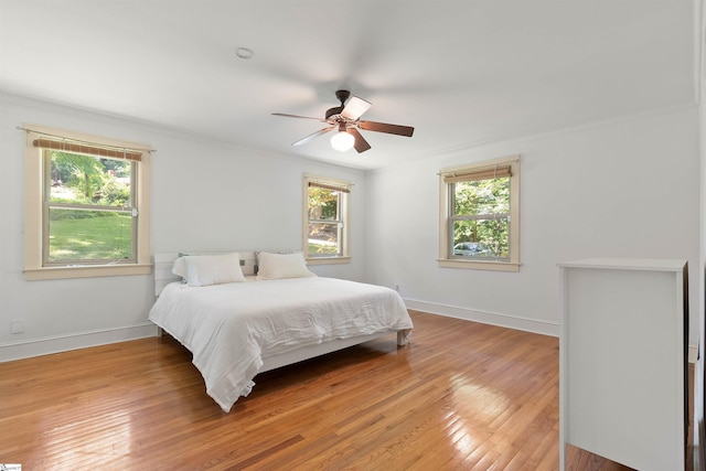 100 Maxwell Rd, Spartanburg, SC 29302 - bedroom with multiple windows, baseboards, light wood-type flooring, and ceiling fan