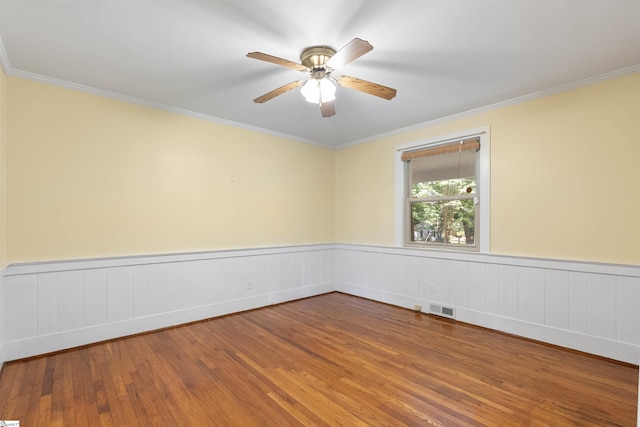 100 Maxwell Rd, Spartanburg, SC 29302 - empty room with hardwood / wood-style floors, crown molding, ceiling fan, and wainscoting