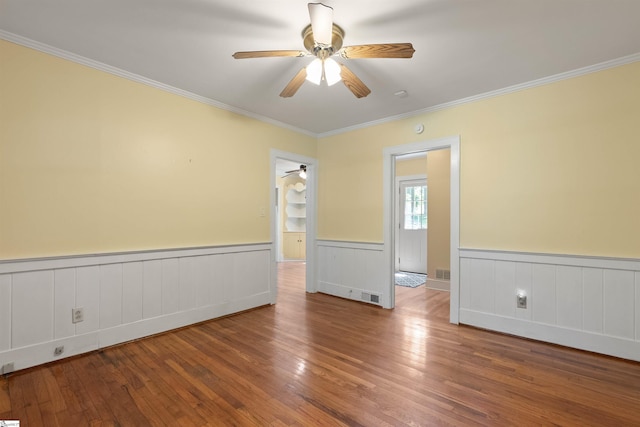 100 Maxwell Rd, Spartanburg, SC 29302 - empty room featuring ceiling fan, wood finished floors, crown molding, and a wainscoted wall