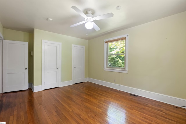 100 Maxwell Rd, Spartanburg, SC 29302 - unfurnished bedroom with two closets, hardwood / wood-style flooring, baseboards, and ceiling fan