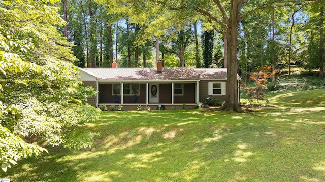 100 Maxwell Rd, Spartanburg, SC 29302 - ranch-style home with a chimney, a front lawn, and view of wooded area