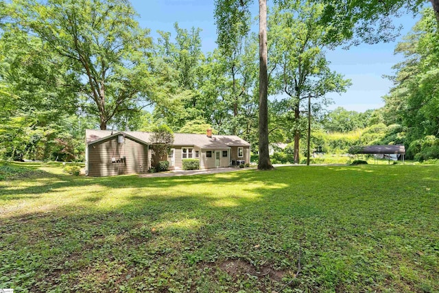 100 Maxwell Rd, Spartanburg, SC 29302 - view of grassy yard featuring a patio area