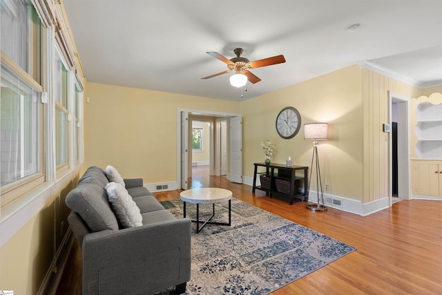 100 Maxwell Rd, Spartanburg, SC 29302 - living room featuring wood finished floors, a ceiling fan, baseboards, and crown molding