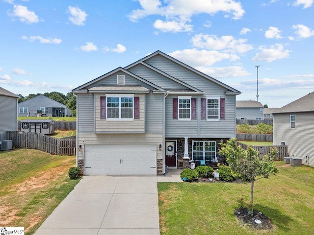 559 Falls Cottage Run, Boiling Springs, SC 29316 - view of front of property featuring an attached garage, stone siding, driveway, and central AC
