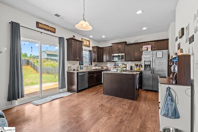 559 Falls Cottage Run, Boiling Springs, SC 29316 - kitchen featuring appliances with stainless steel finishes, dark brown cabinets, a kitchen island, pendant lighting, and dark wood finished floors