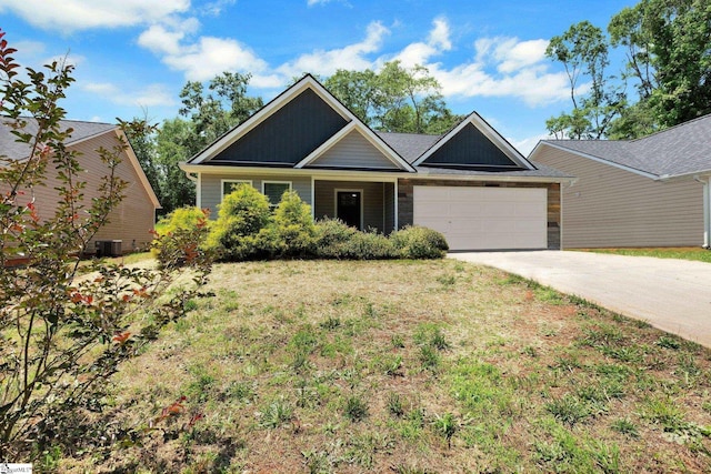 184 Sandifer Rd, Spartanburg, SC 29303 - view of front of house featuring an attached garage, driveway, central AC unit, and a front lawn