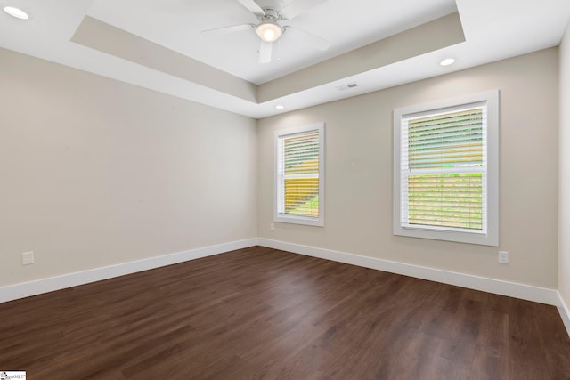 184 Sandifer Rd, Spartanburg, SC 29303 - empty room featuring baseboards, dark wood-style floors, recessed lighting, ceiling fan, and a raised ceiling