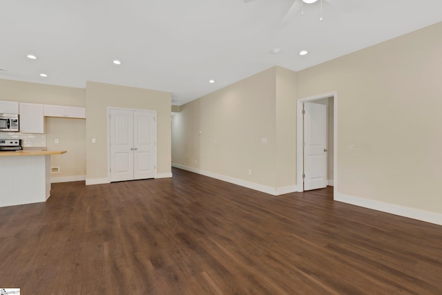 184 Sandifer Rd, Spartanburg, SC 29303 - unfurnished living room featuring dark wood finished floors, ceiling fan, baseboards, and recessed lighting
