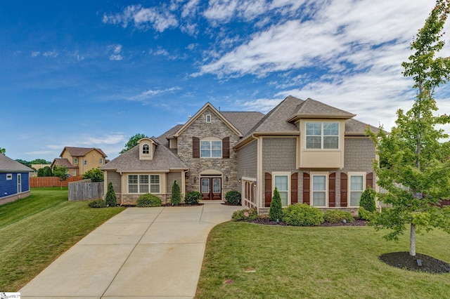 131 Riverland Woods Ct, Simpsonville, SC 29681 - view of front facade featuring stone siding, concrete driveway, and roof with shingles