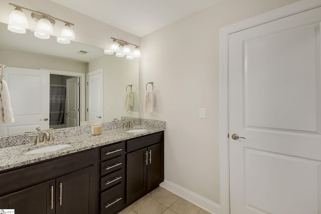 131 Riverland Woods Ct, Simpsonville, SC 29681 - full bath with double vanity, tile patterned flooring, and baseboards