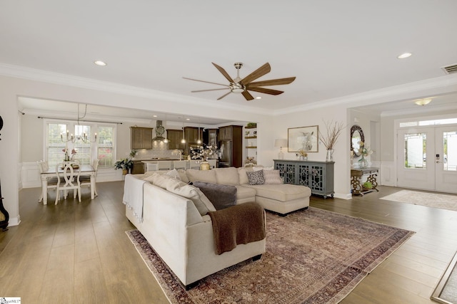 131 Riverland Woods Ct, Simpsonville, SC 29681 - living room with a chandelier, french doors, dark wood-type flooring, a ceiling fan, and ornamental molding