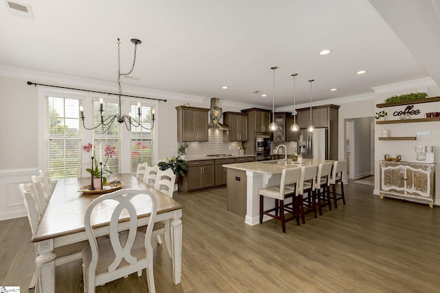 131 Riverland Woods Ct, Simpsonville, SC 29681 - dining area featuring ornamental molding, a chandelier, dark wood finished floors, recessed lighting, and wainscoting