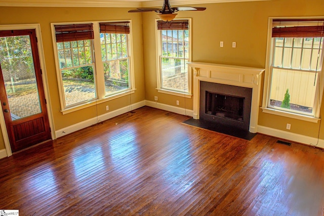 231 Austin Brook St, Simpsonville, SC 29680 - unfurnished living room featuring a ceiling fan, healthy amount of natural light, crown molding, baseboards, and wood finished floors