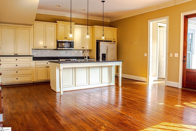 231 Austin Brook St, Simpsonville, SC 29680 - kitchen with appliances with stainless steel finishes, cream cabinets, dark countertops, backsplash, and ornamental molding