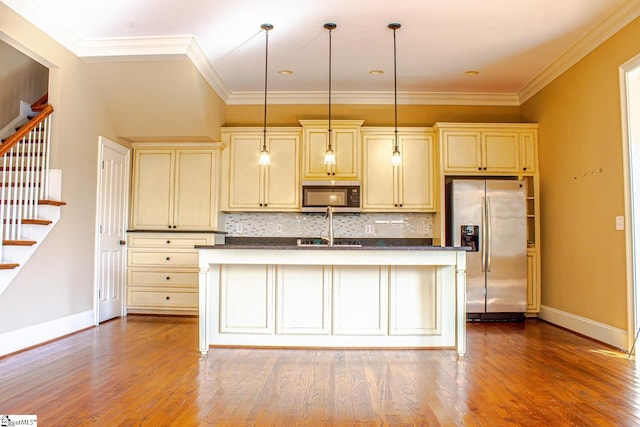 231 Austin Brook St, Simpsonville, SC 29680 - kitchen featuring stainless steel appliances, cream cabinets, baseboards, and crown molding