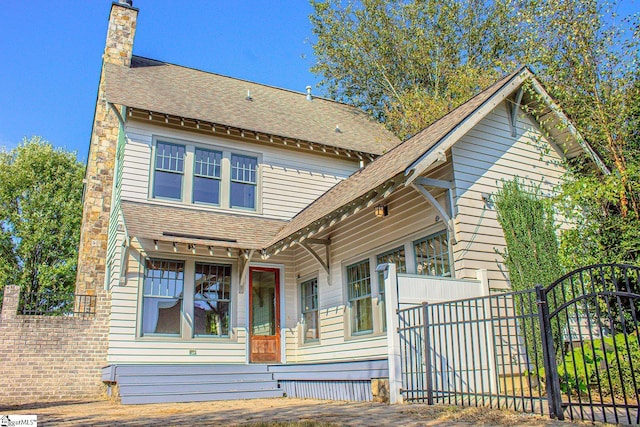 231 Austin Brook St, Simpsonville, SC 29680 - view of front of house featuring roof with shingles and a chimney