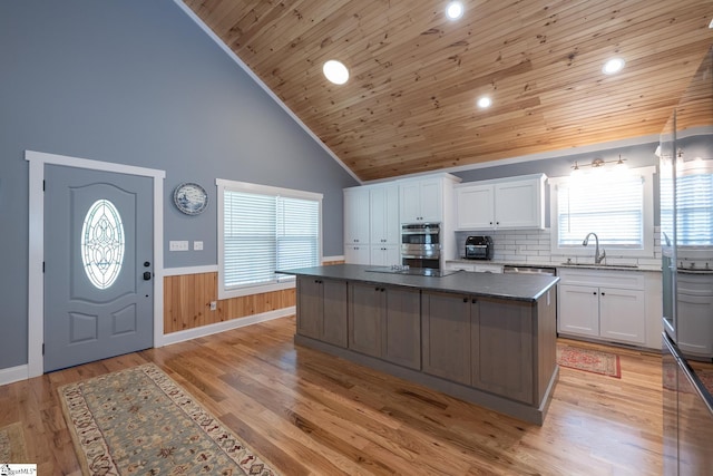 1122 Midway Rd, Pickens, SC 29671 - kitchen with wainscoting, wood ceiling, a kitchen island, high vaulted ceiling, and white cabinetry