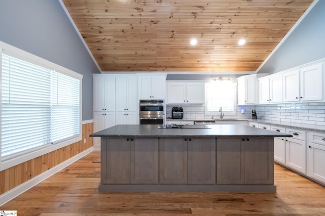 1122 Midway Rd, Pickens, SC 29671 - kitchen featuring lofted ceiling, double oven, wood ceiling, a center island, and wainscoting