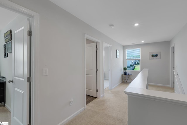 212 Ralston Dr, Greer, SC 29651 - hall featuring light colored carpet, baseboards, recessed lighting, and an upstairs landing