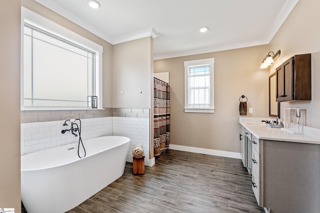 222 Blease Horton Rd, Boiling Springs, SC 29316 - bathroom featuring vanity, a freestanding bath, crown molding, tile walls, and wood finished floors
