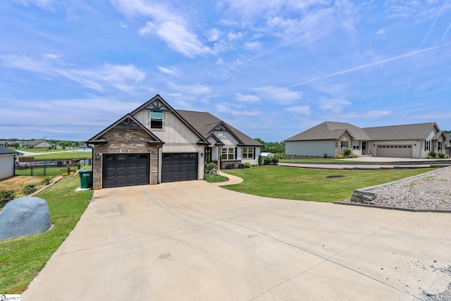 222 Blease Horton Rd, Boiling Springs, SC 29316 - view of front facade with a front lawn, driveway, a garage, stone siding, and board and batten siding