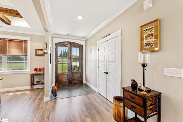 222 Blease Horton Rd, Boiling Springs, SC 29316 - foyer featuring arched walkways, crown molding, baseboards, wood finished floors, and french doors