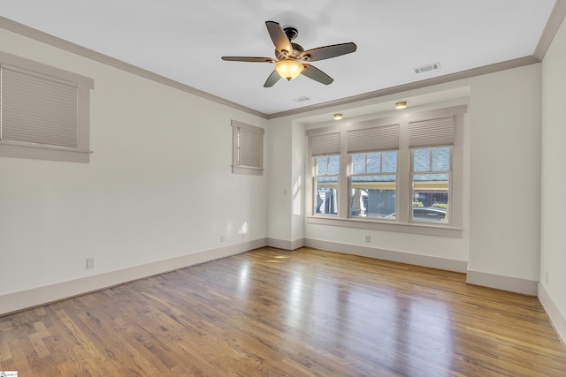 509B Townes St, Greenville, SC 29601 - spare room with ceiling fan, baseboards, wood finished floors, and ornamental molding