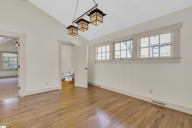 509B Townes St, Greenville, SC 29601 - unfurnished dining area with healthy amount of natural light, baseboards, ceiling fan, wood finished floors, and high vaulted ceiling