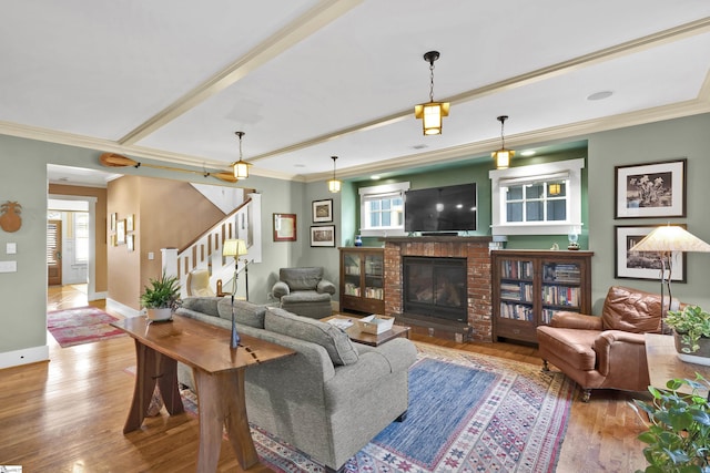 509B Townes St, Greenville, SC 29601 - living area featuring wood finished floors, stairway, ornamental molding, a brick fireplace, and baseboards