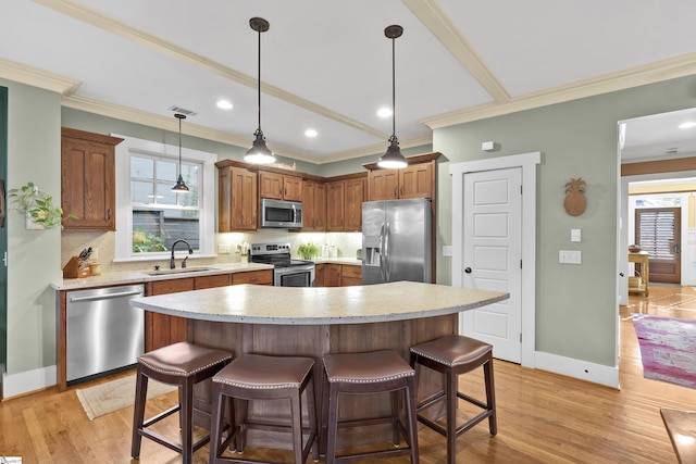 509B Townes St, Greenville, SC 29601 - kitchen featuring stainless steel appliances, a sink, decorative backsplash, plenty of natural light, and crown molding