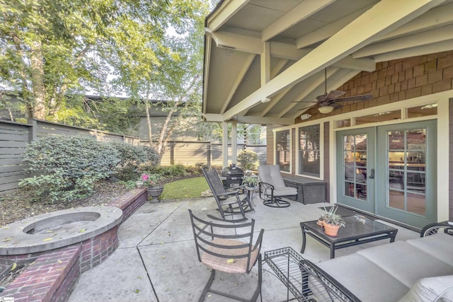 509B Townes St, Greenville, SC 29601 - fenced backyard with an outdoor fire pit, french doors, a ceiling fan, and a patio
