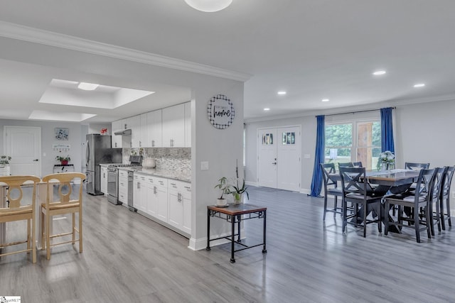 203 Rock Springs Rd, Belton, SC 29627 - kitchen with stainless steel appliances, light wood finished floors, recessed lighting, ornamental molding, and baseboards