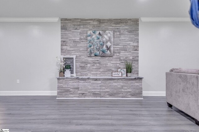 203 Rock Springs Rd, Belton, SC 29627 - living area featuring crown molding, an accent wall, baseboards, and wood finished floors
