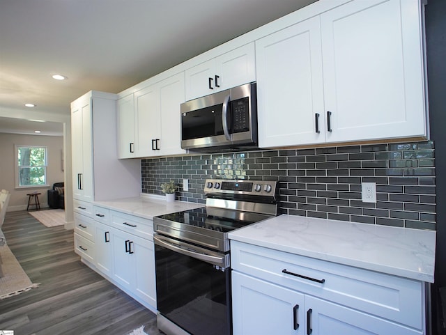 310 Sloping Meadow Dr, Inman, SC 29349 - kitchen with stainless steel appliances, dark wood finished floors, white cabinets, light stone counters, and recessed lighting