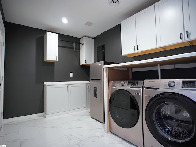 310 Sloping Meadow Dr, Inman, SC 29349 - washroom with washer and dryer, light marble finish floors, baseboards, recessed lighting, and cabinet space